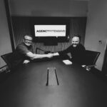 mikey and richard hand shaking